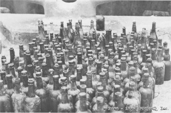Beer and Wine
bottles empty and full, damaged and intact
scores of cases remain.