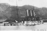 The Russian protected cruiser Pallada wrecked at Port Arthur as a result of bombardment by Japanese land based artillery during 